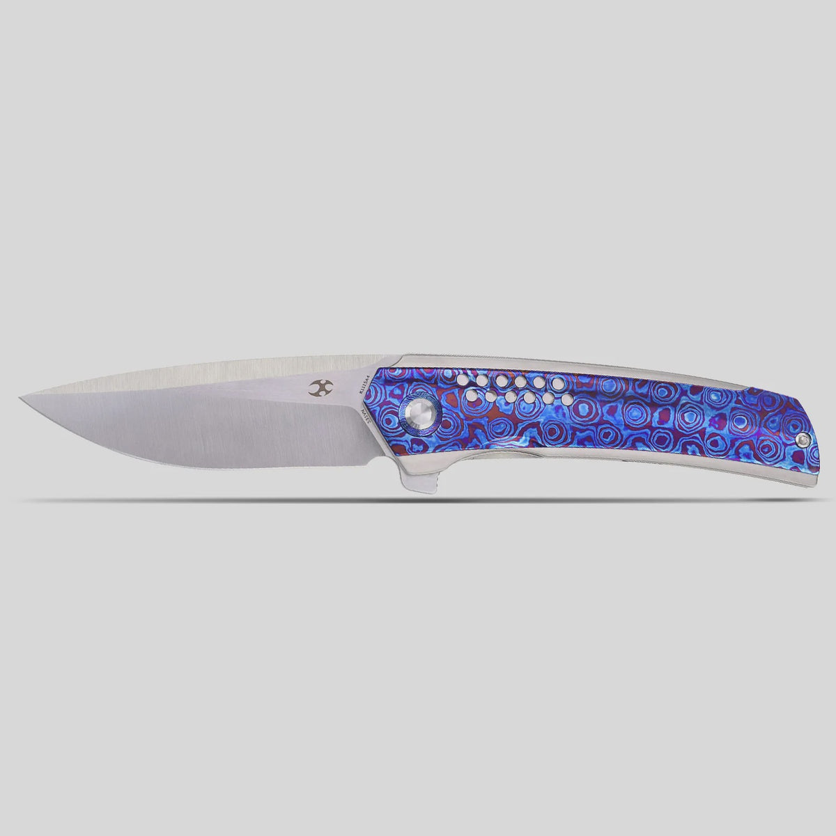 Kansept Tracer K1115A4 CPM-S35VN frame-lock folder with titanium and Timascus, open flat lay on a white background