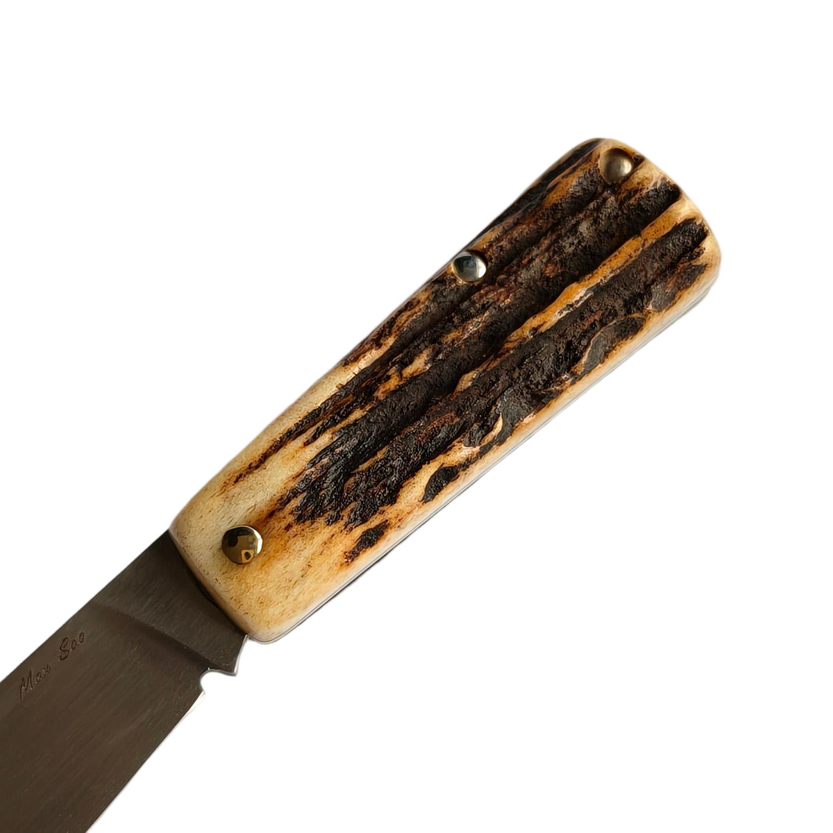 Macro shot of the Sao Knife Elephant handle showing the natural bark texture of the sambar stag antler scales