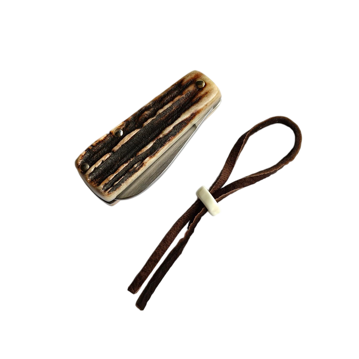 The Sao Knife Elephant slip joint closed, shown alongside its brown leather lanyard with a carved bead