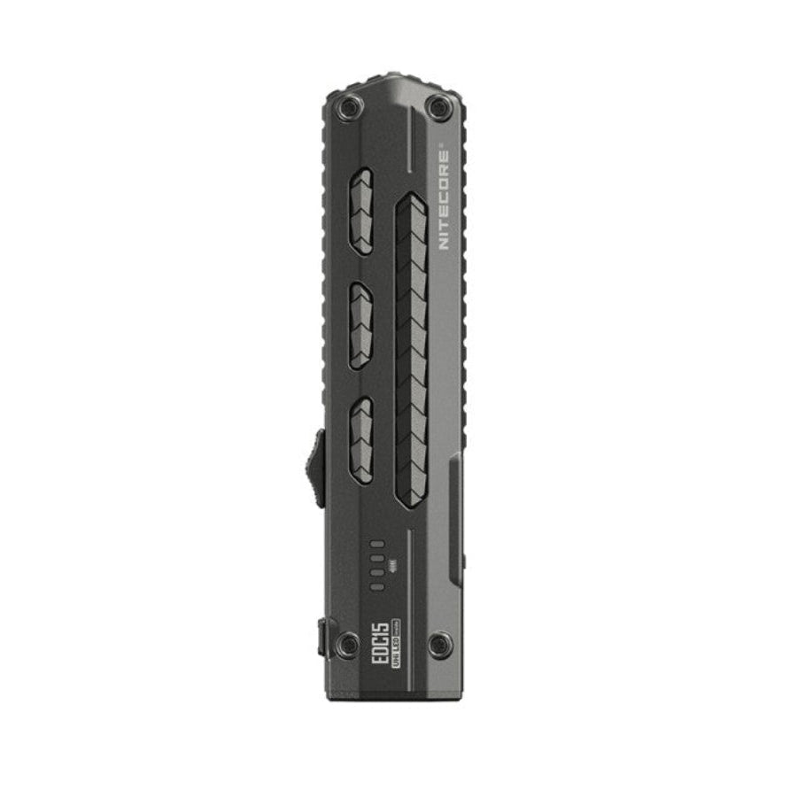 The Nitecore EDC15 standing on its tail, showing the slide switch and M button on its flank of the PVD stainless body