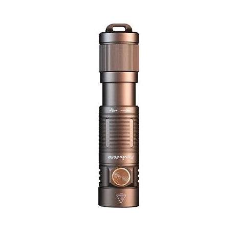 Fenix E05R Mini keychain light standing upright on its tail cap in brown anodized aluminium with the LED head facing up