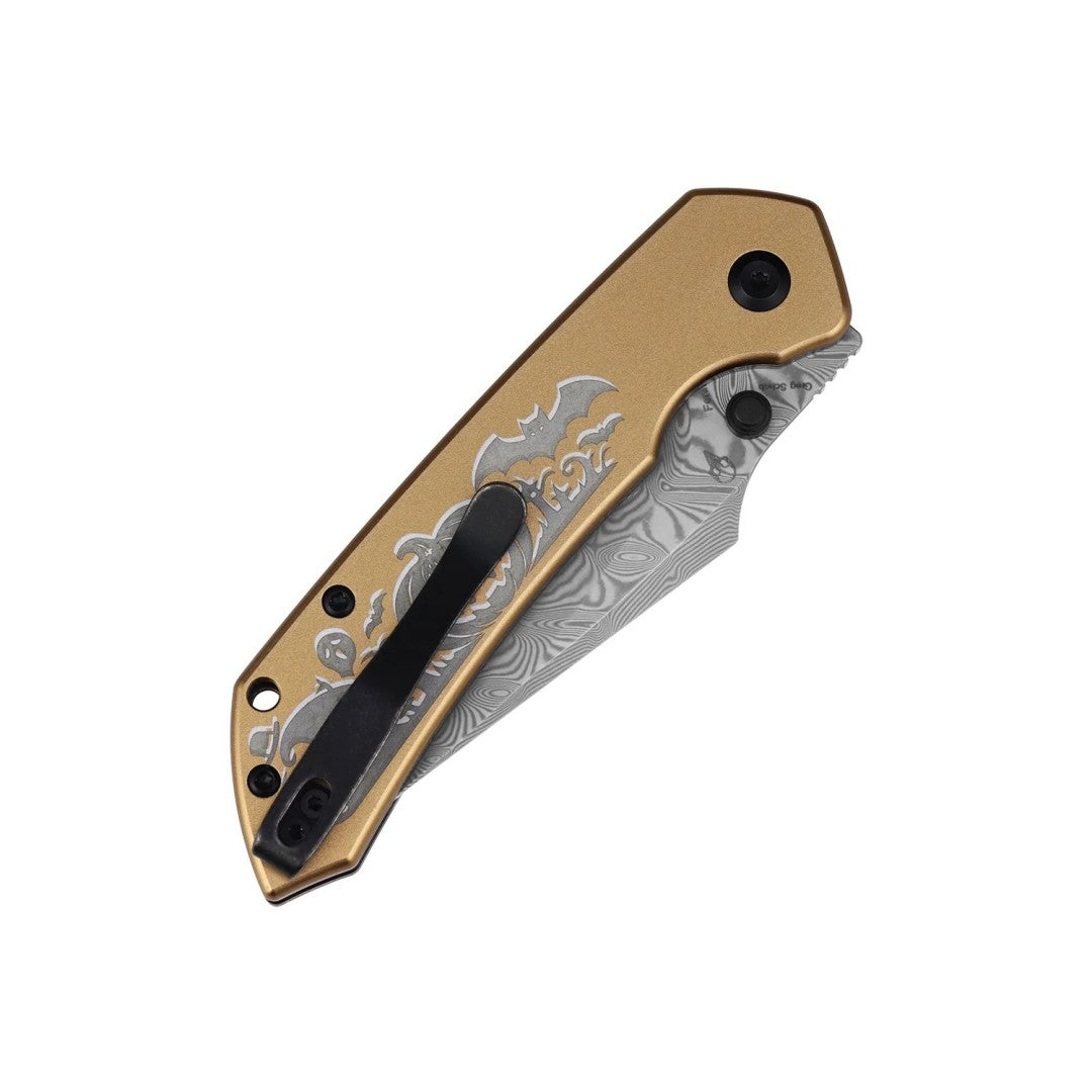 Rear three-quarter view of the closed B1034H24 folder showing golden anodized aluminum scales and lanyard hole