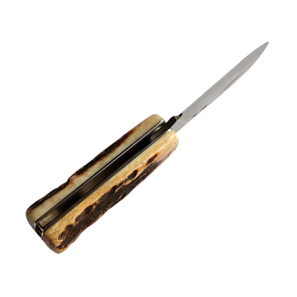 Spine-side view of the Sao Knife Elephant slip joint half open with the blade partly deployed on a white background